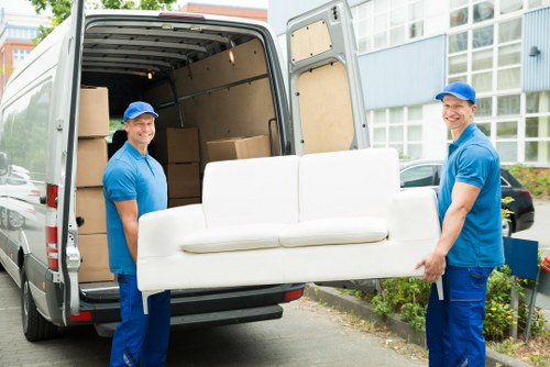 Specialist team preparing an upright piano move in Twickenham