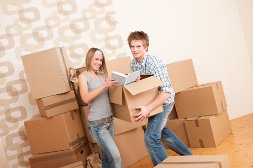 Worker assessing lifting and access risks before a move