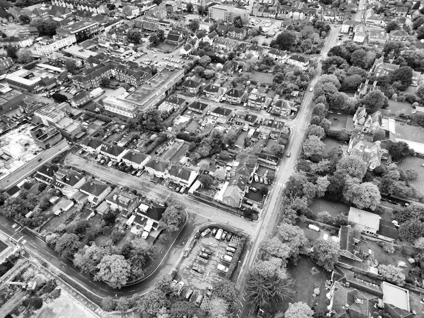 An aerial black and white photograph showing a row of residential houses on Church Street in Twickenham, with rooftops and backyards visible. Several parked cars line the narrow street in front of the